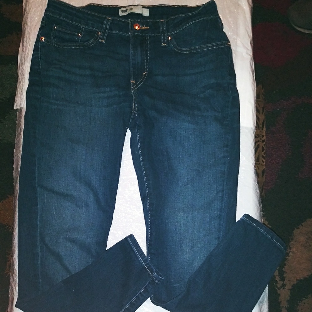 Dark blue fitted jeans that r faded through out